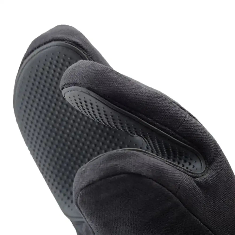Close-up of a black oven glove with textured palm and fingers on a white background
