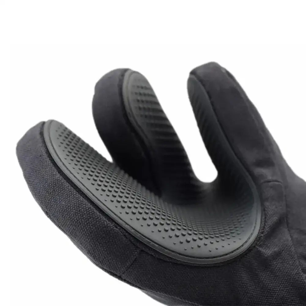 Black glove with textured palm on a white background