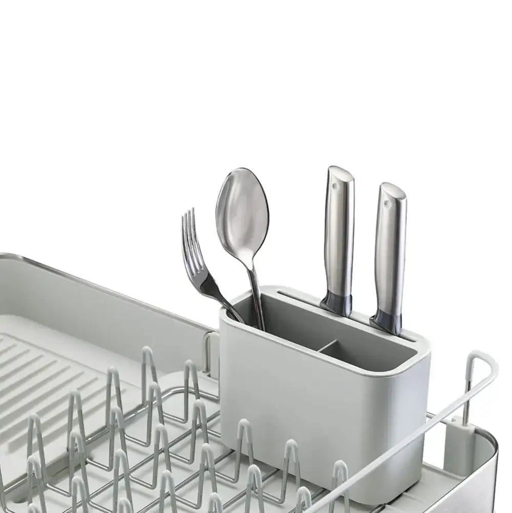 Silver cutlery set in a holder inside a dishwasher