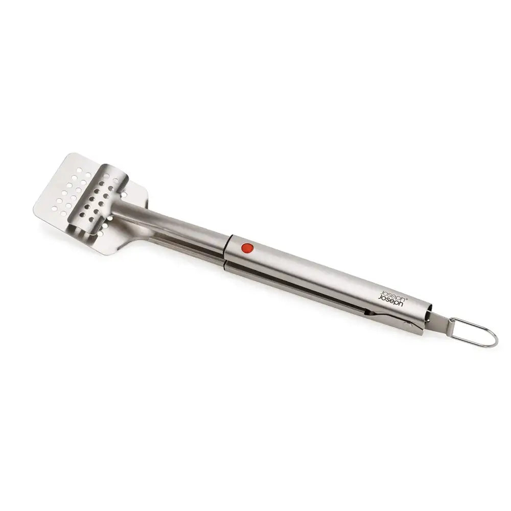 Stainless steel spatula with a red button on a white background