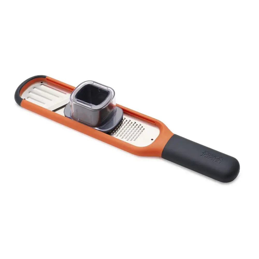 Multifunctional kitchen tool with orange handle and silver blade on a white background