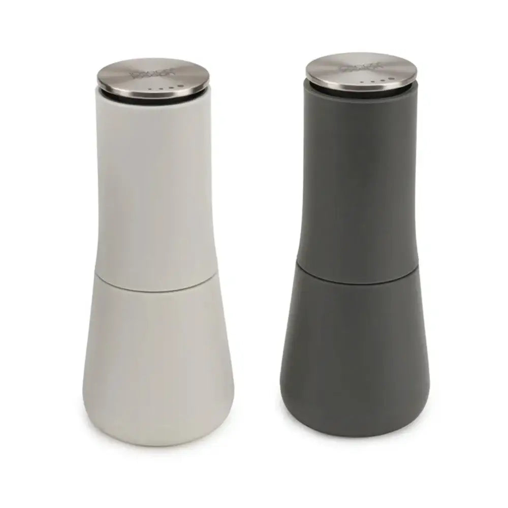 Two salt and pepper shakers, one white and one gray, on a white background.