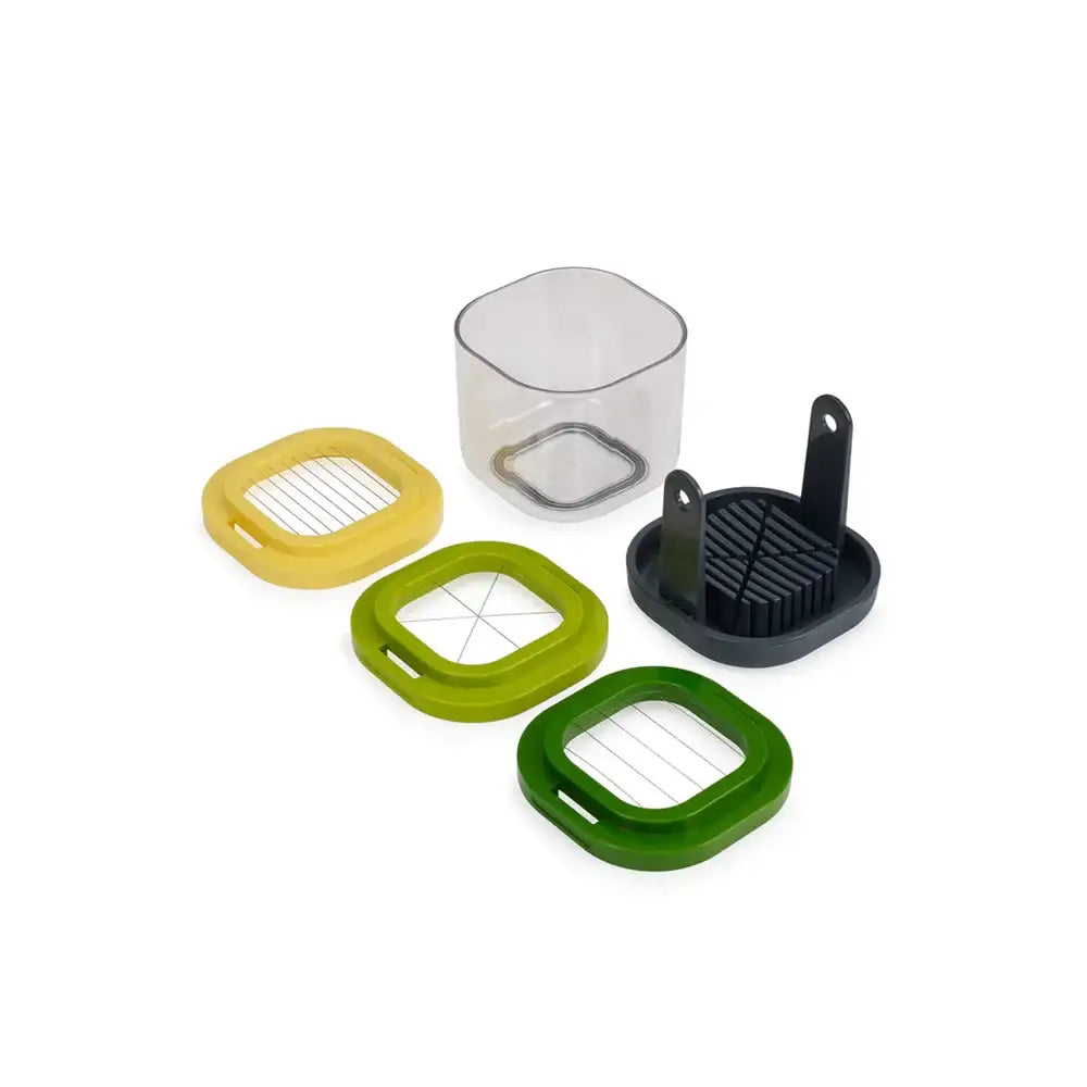 Set of kitchen tools including a square clear container, yellow, green, and black attachments on a white background.