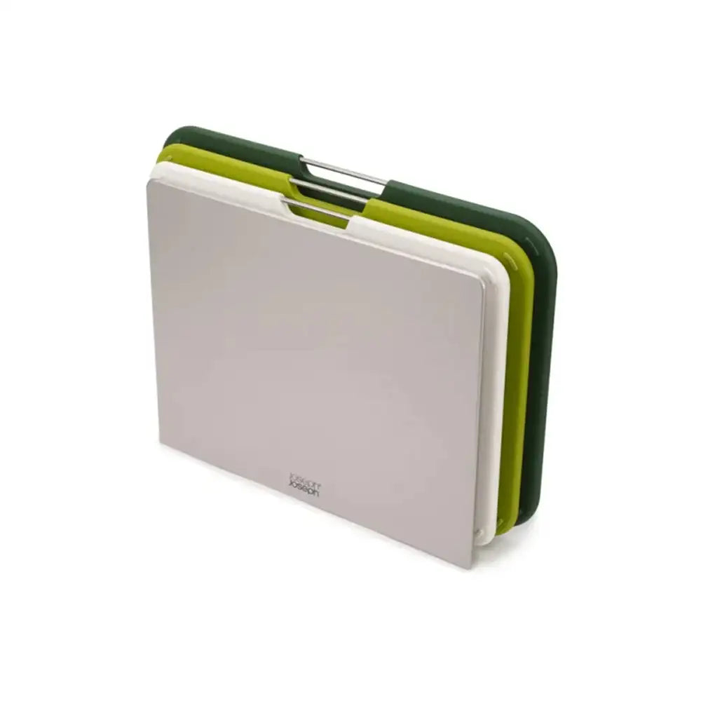 Set of three cutting boards with green, white, and black covers on a white background