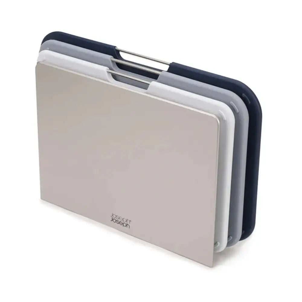 Set of three chopping boards in beige, gray, and navy on a white background