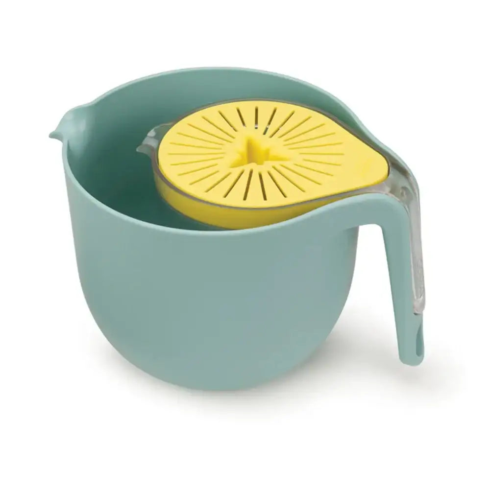 Green and yellow citrus juicer on a white background