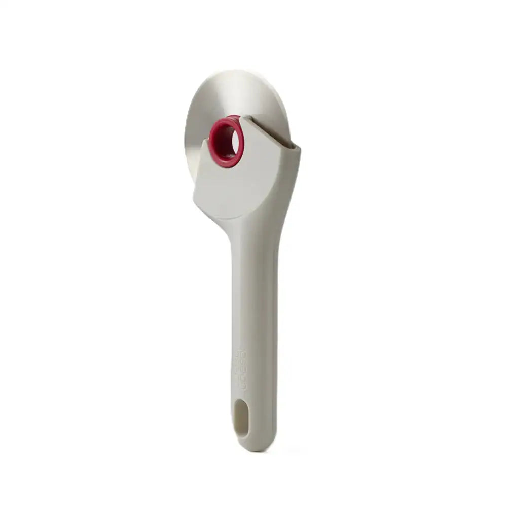 White kitchen tool with red component on a white background
