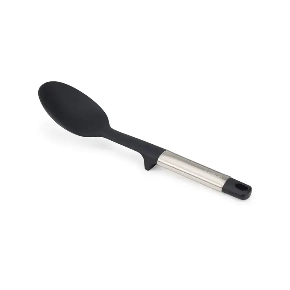 Black spoon with a metallic handle on a white background