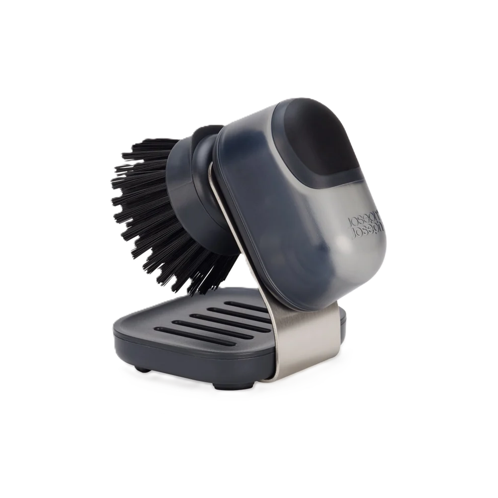 Black soap dispensing brush on a white background