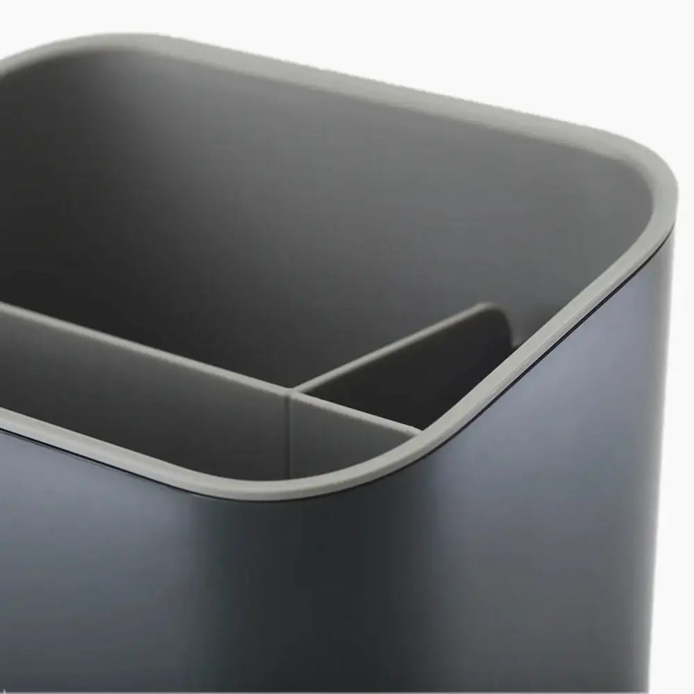 Gray plastic bin with a white interior on a white background