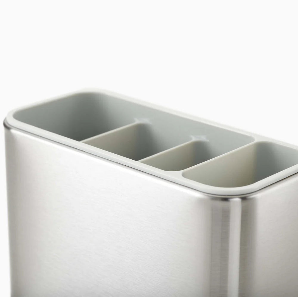 Silver utensil holder with three compartments on a white background