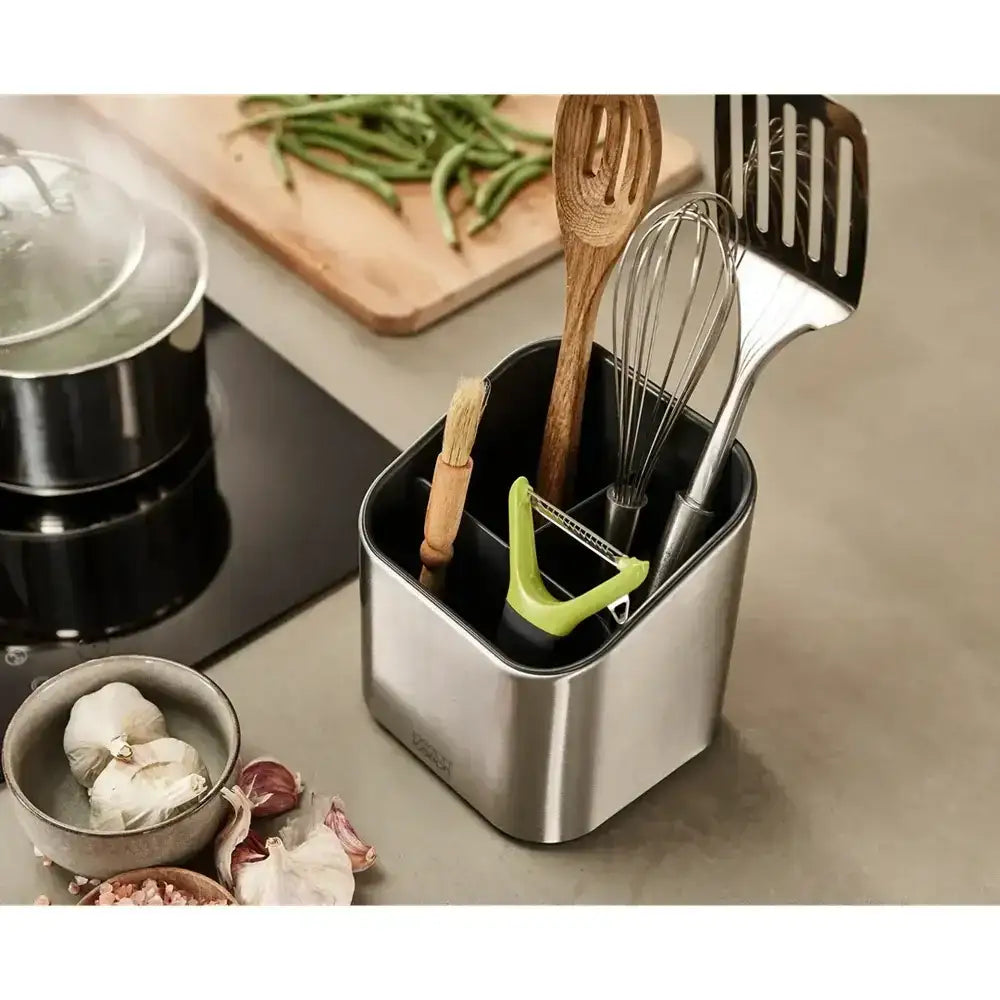 Kitchen utensil holder with utensils on a kitchen counter