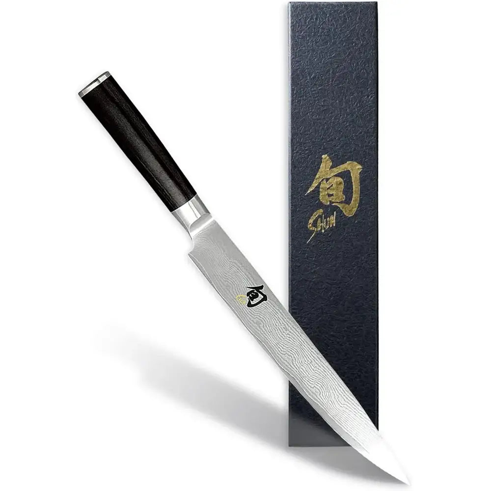 Japanese knife with a black handle and gold text on a white background