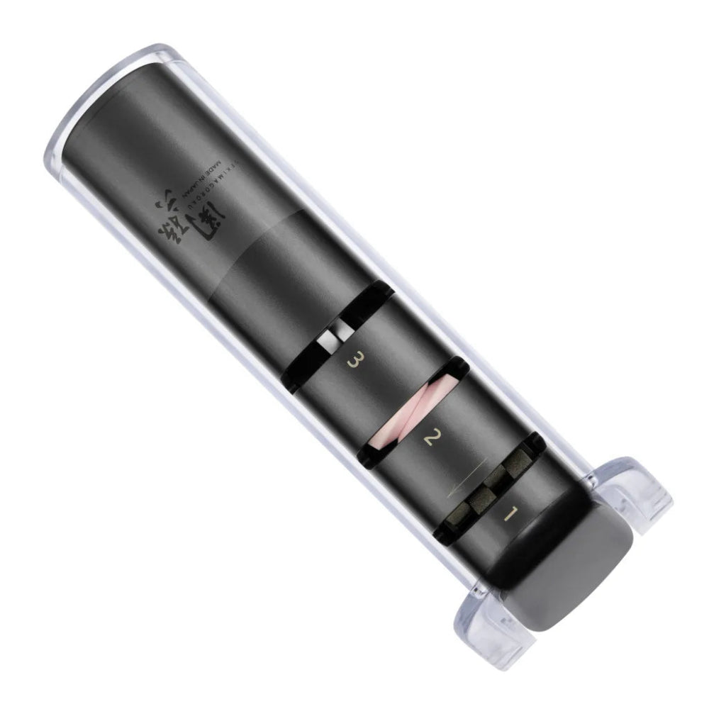 Black and clear cosmetic product with visible brand name on a white background