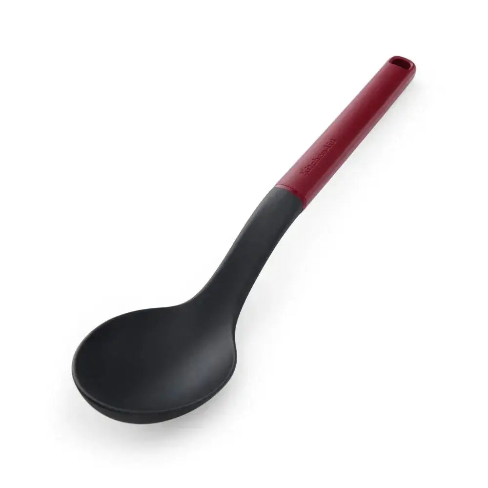 Black spoon with a red handle on a white background