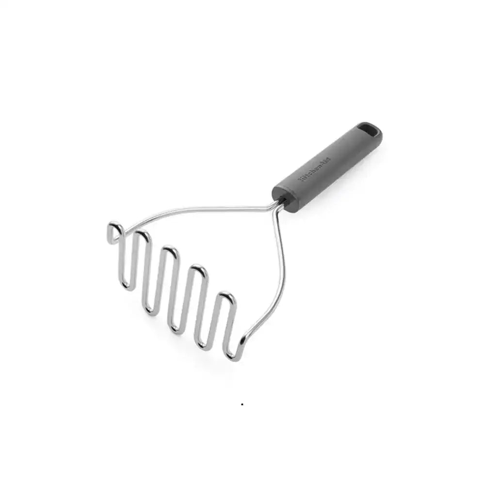 Metal potato masher with a black handle on a white background