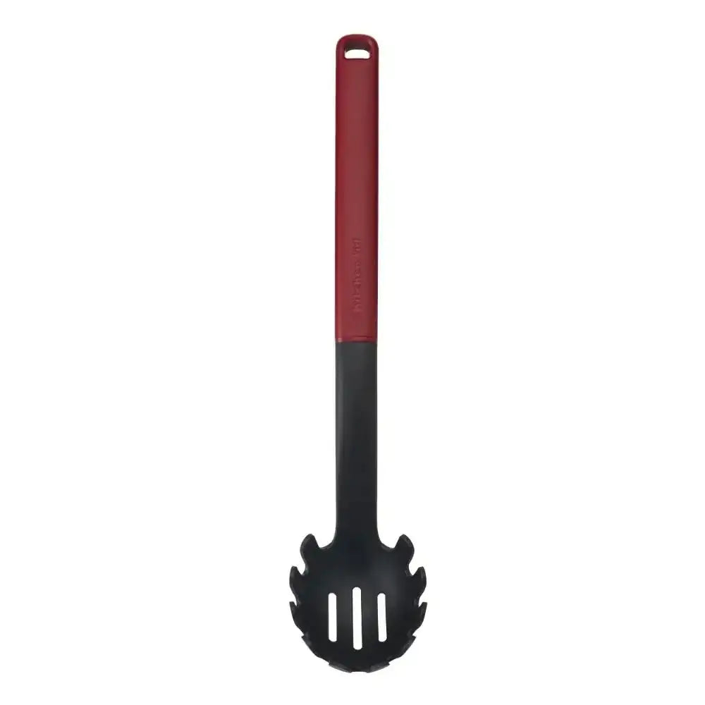 Black slotted spoon with red handle on a white background