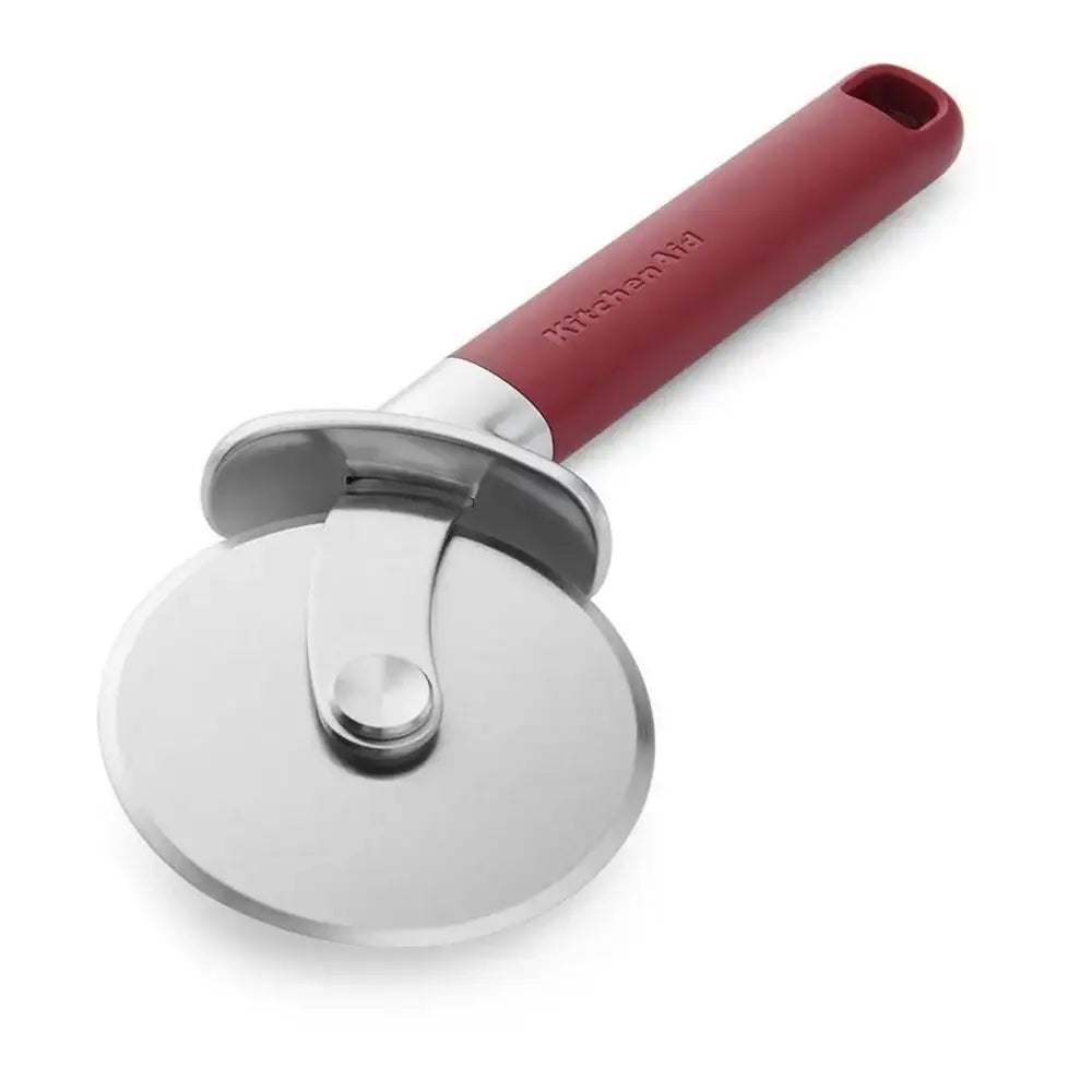 Red-handled pizza cutter on a white background
