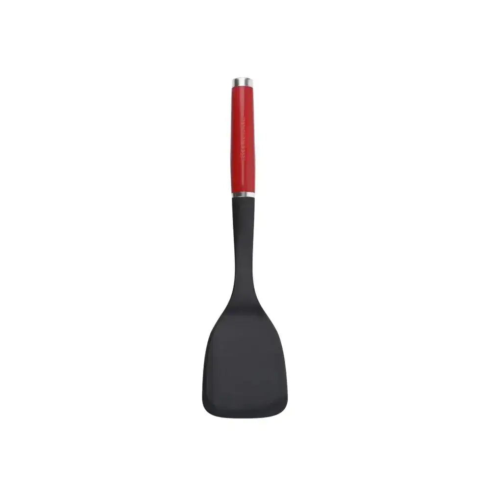 Black spatula with a red handle on a white background
