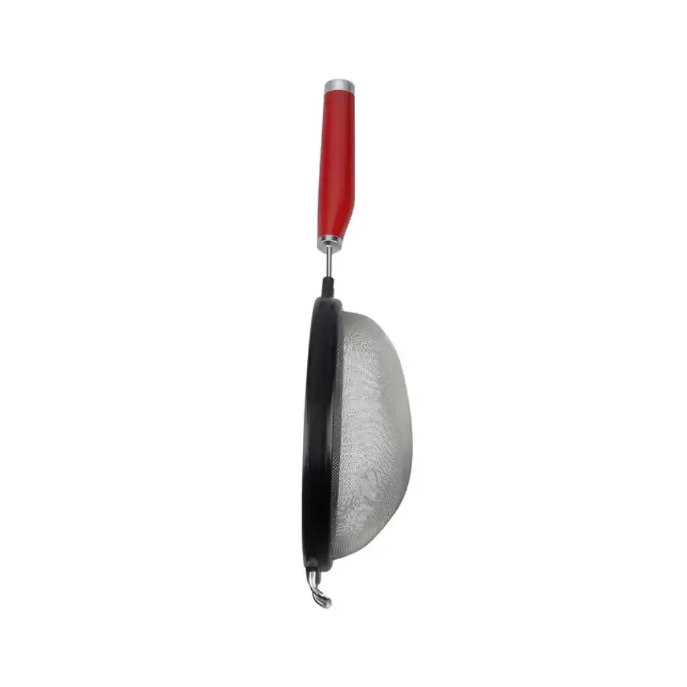Metal strainer with a red handle on a white background