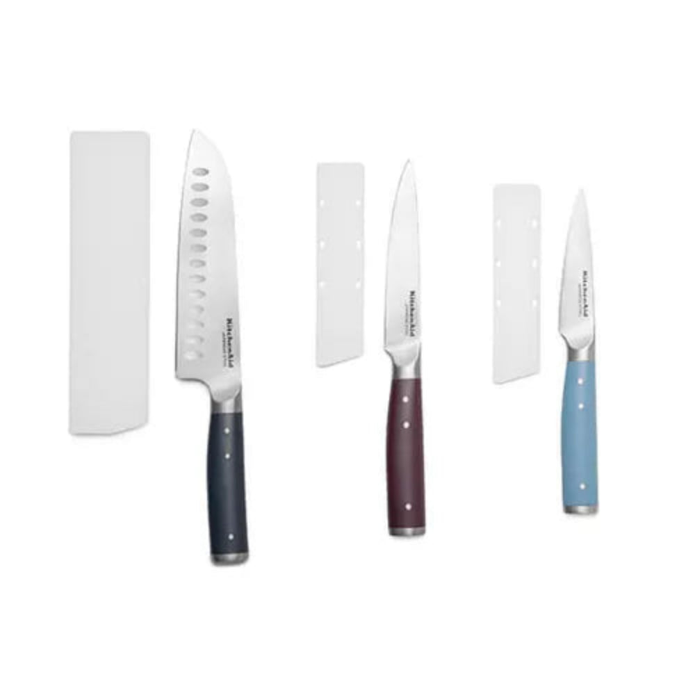 Set of knives with colored handles on a white background