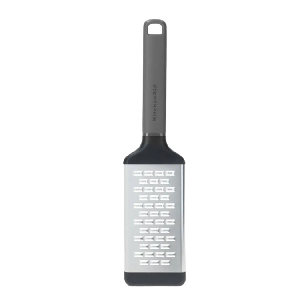 KitchenAid vertical medium grater with a silver metal blade, dark gray handle, and black base, shown on a plain white background.
