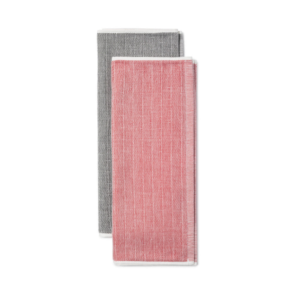 Two folded napkins, one gray and one pink, on a white background
