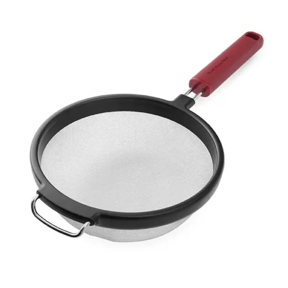 Metal strainer with a red handle on a white background