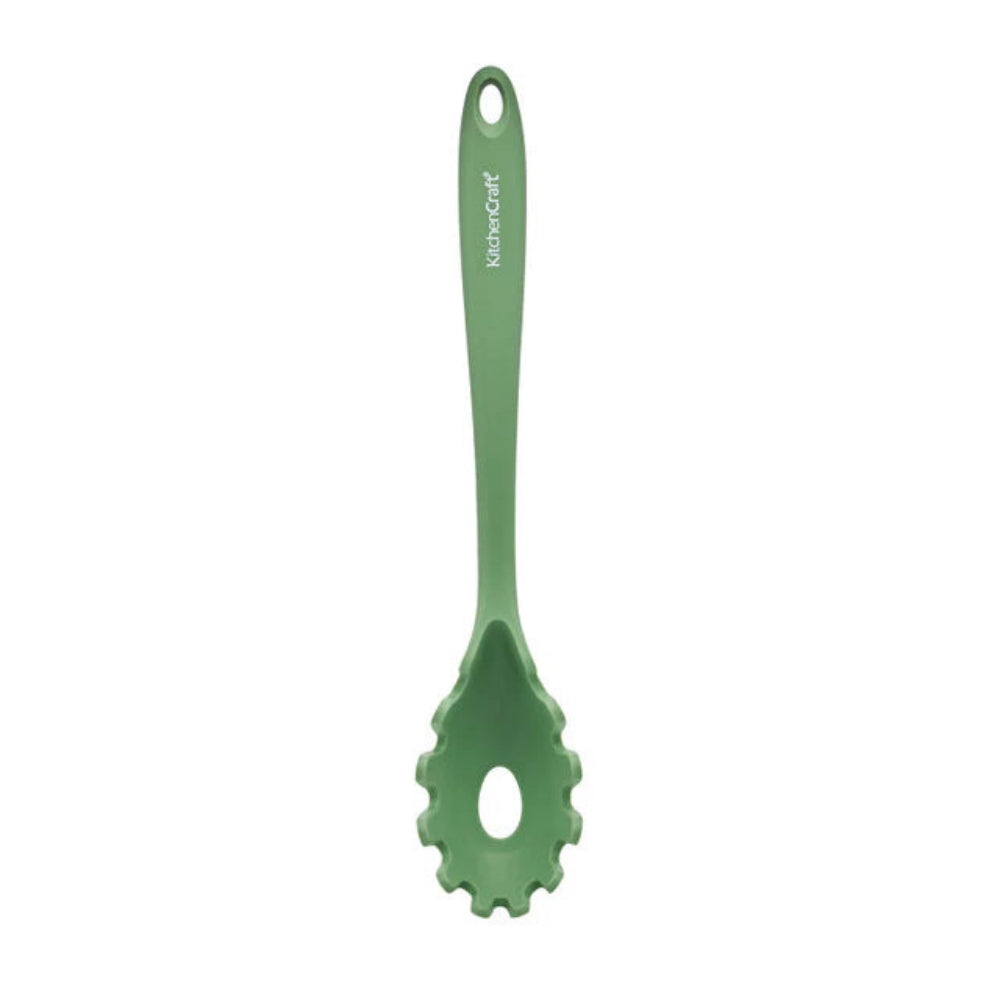 Green pasta serving spoon on a white background