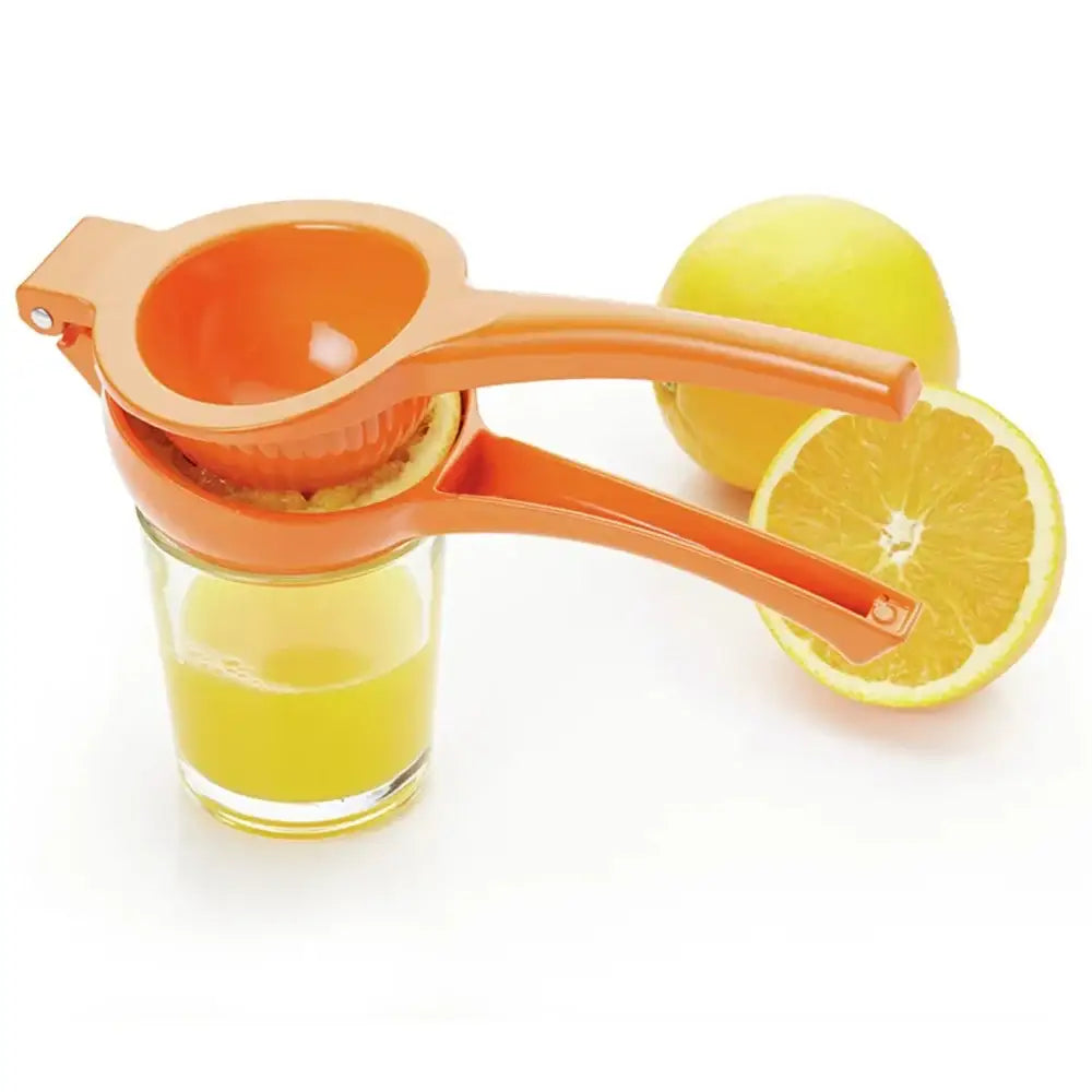 Orange manual juicer with a glass of freshly squeezed orange juice and a half-orange on a white background