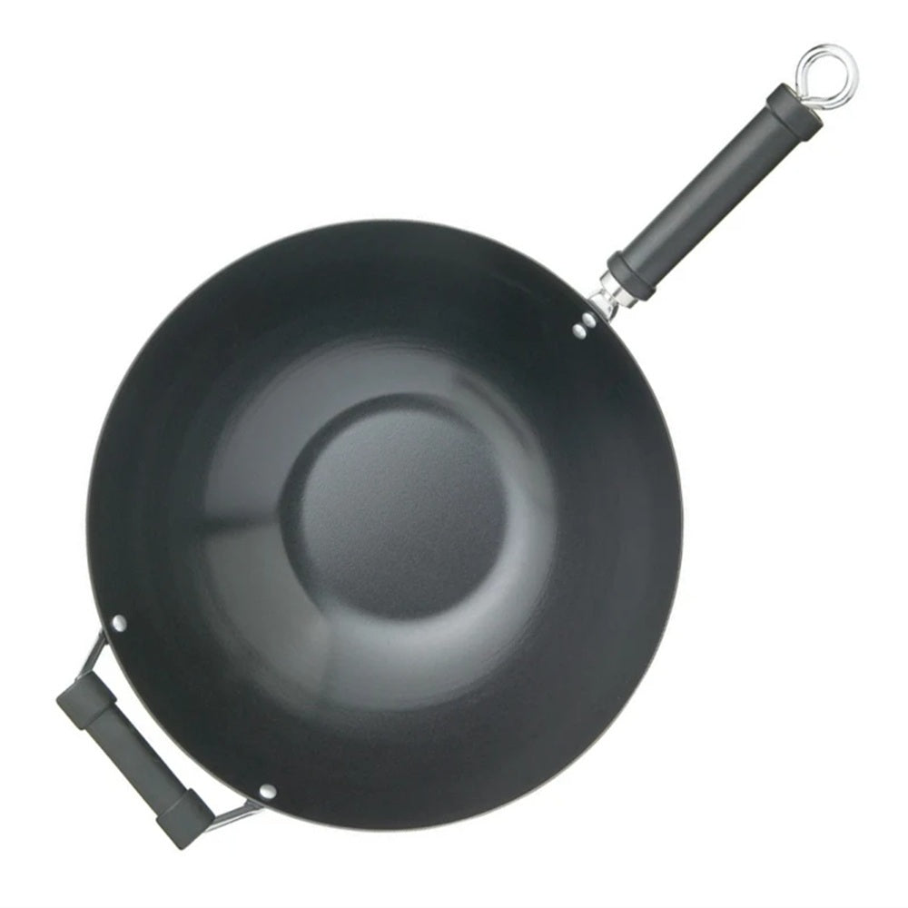 Black wok with a handle on a white background