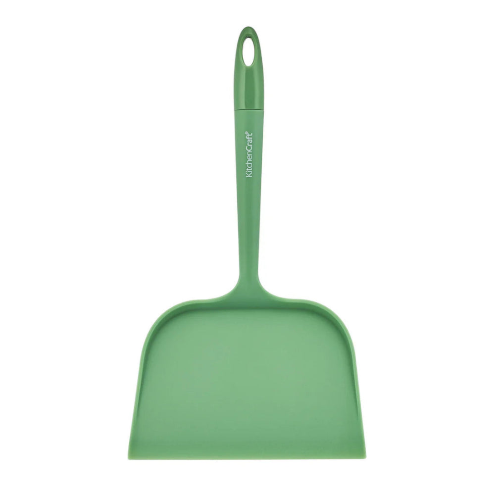 Green dustpan with handle on a white background