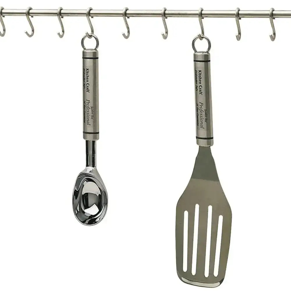Kuhn Rikon kitchen utensils hanging on a rack with a white background