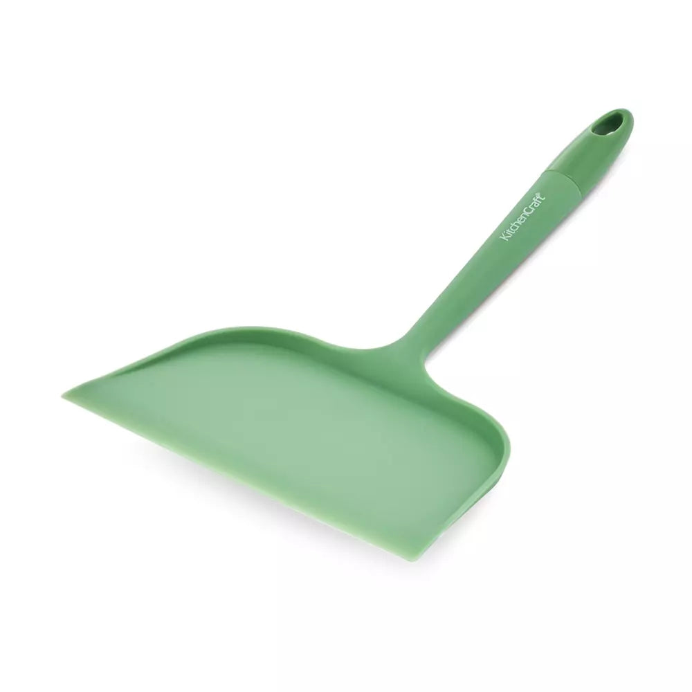 Green silicone roasting scoop on a white background