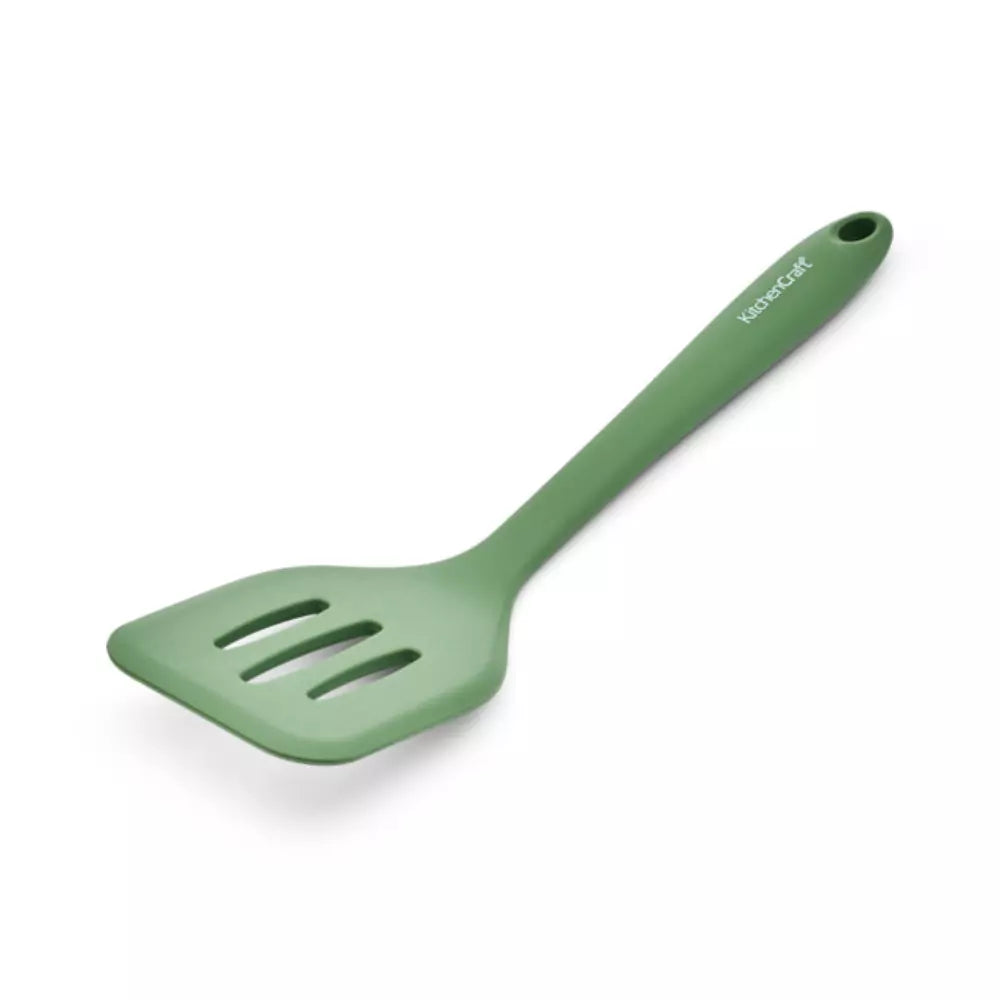 Green slotted turner on a white background