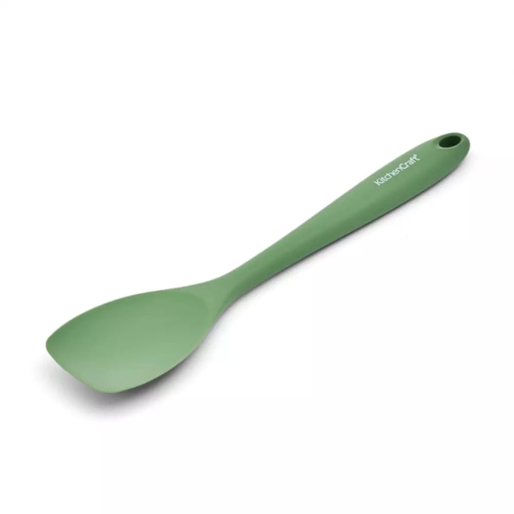 Green spatula on a white background