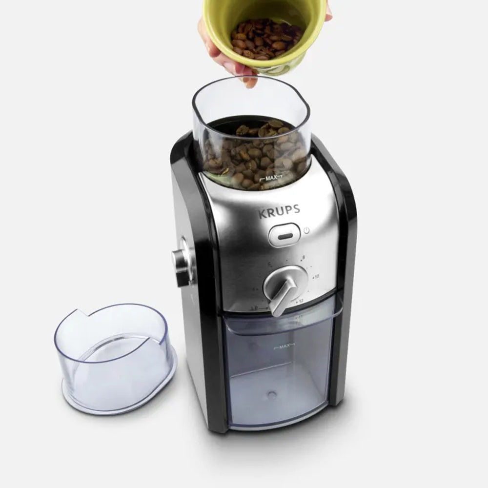 Krups coffee grinder with a clear container on a white background