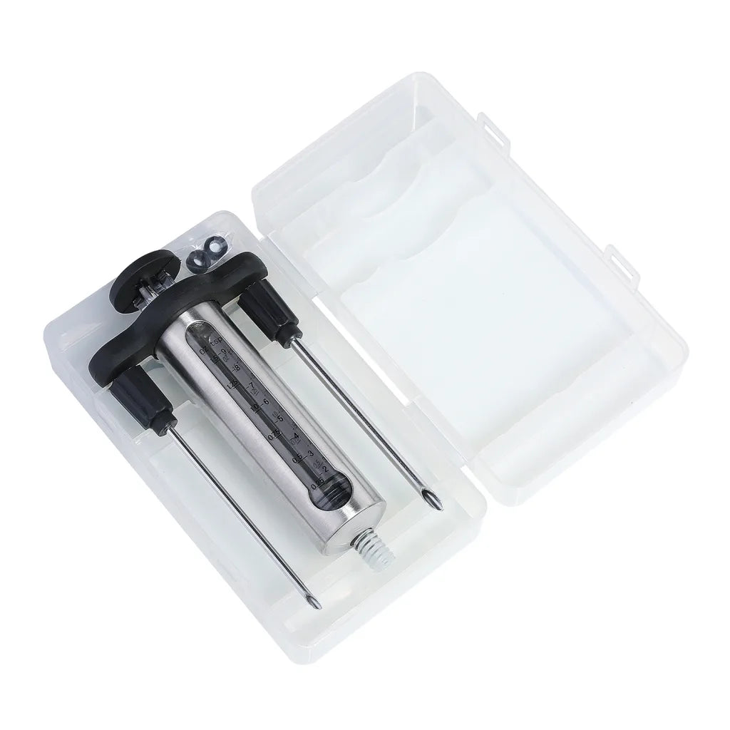 Marinade injector in a clear case with a white background 