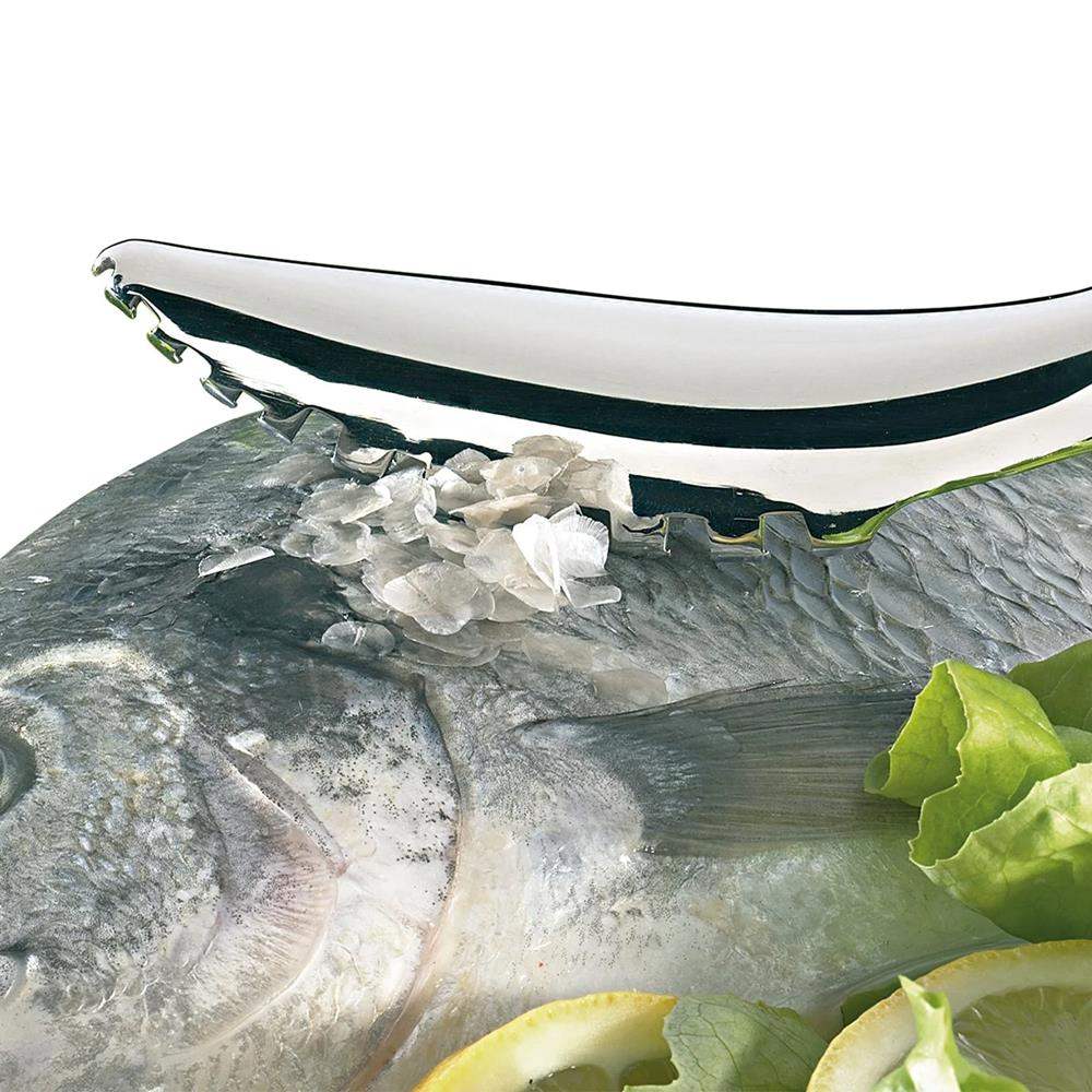 Close-up of a fish with lemon and lettuce on a white background