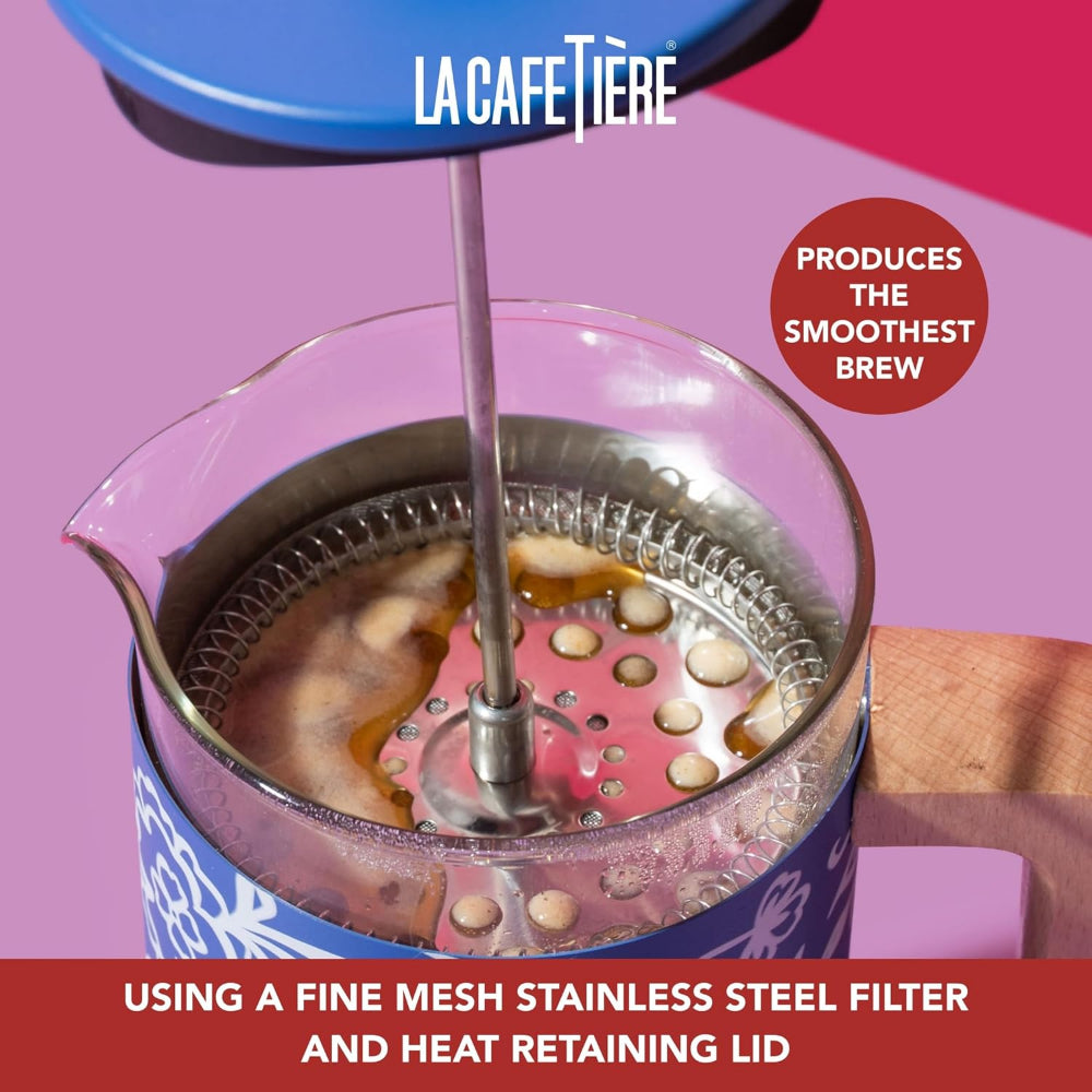 La Cafétière coffee maker with coffee beans and brewing process on a pink background