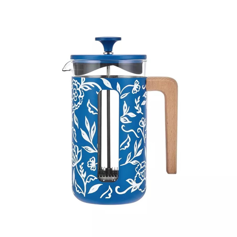 Blue floral-patterned French press with wooden handle on a white background