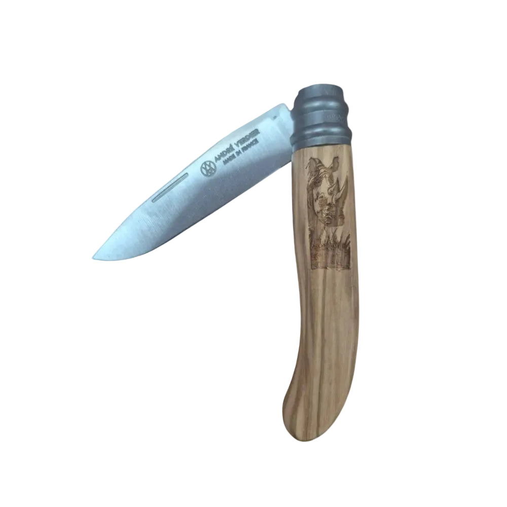 A folding pocket knife with a silver steel blade and a light brown wooden handle featuring an engraved rhinoceros design, shown against a plain white background.