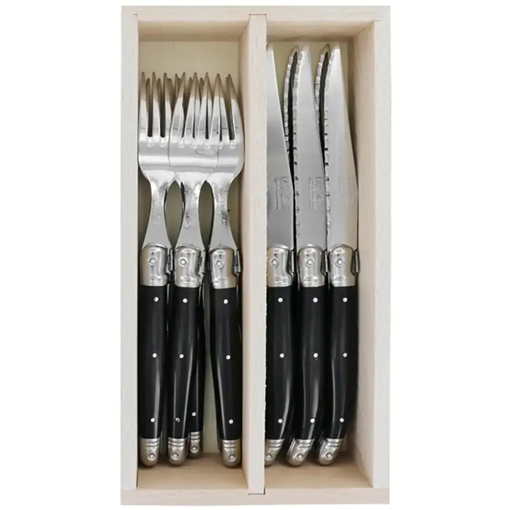 Set of cutlery with black handles in a wooden box