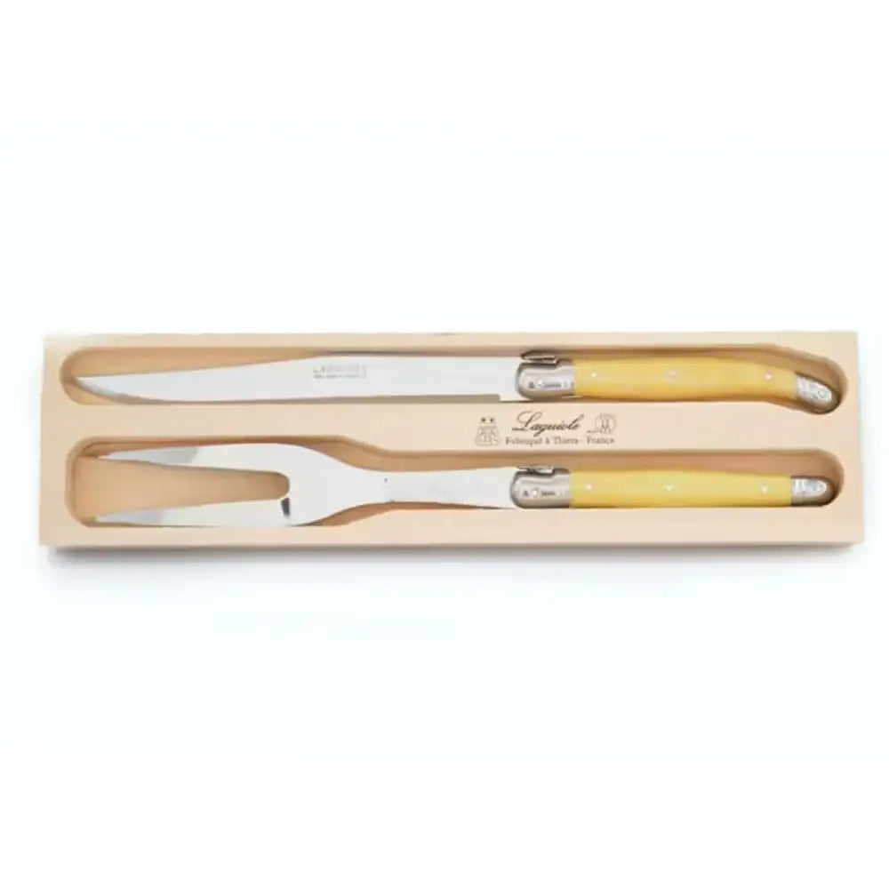 Set of two knives with yellow handles in a wooden box on a white background