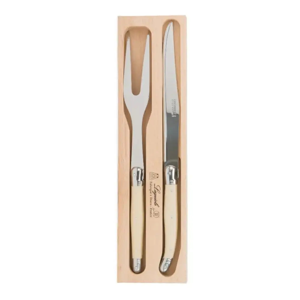 Set of steak knife and fork in wooden packaging on a white background