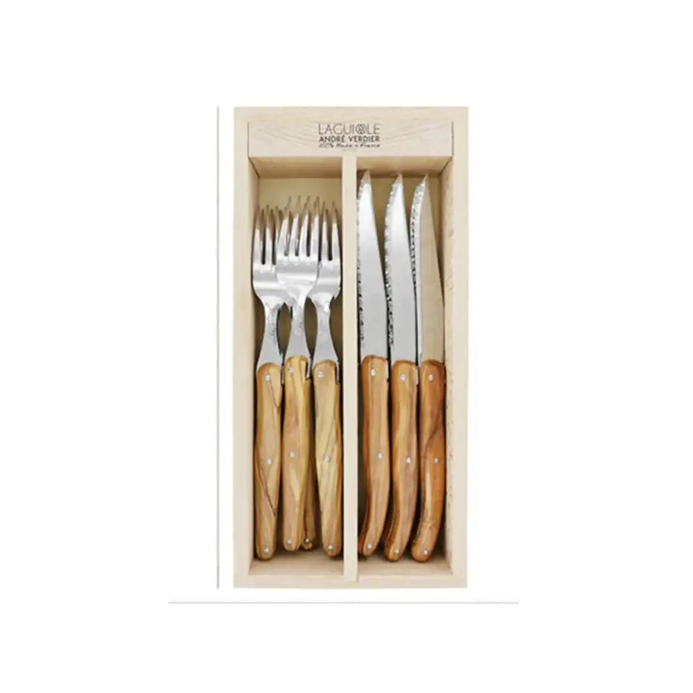 Set of cutlery including forks and knives with wooden handles in a box, brand 'Laguiole' visible.