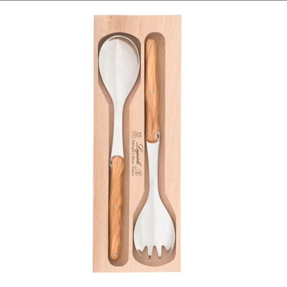 Set of wooden-handled spoon and fork in a wooden box on a white background