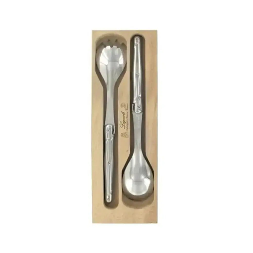 Two silver spoons in a wooden box on a white background