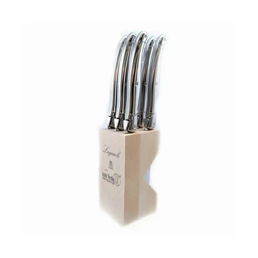 Knife block with stainless steel knives on a white background.