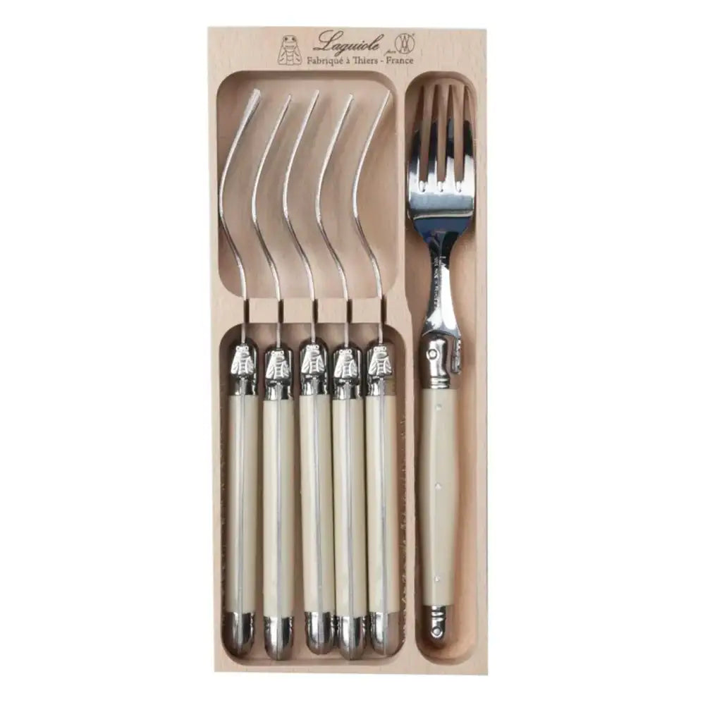 Set of silver cutlery with beige handles in a cardboard packaging
